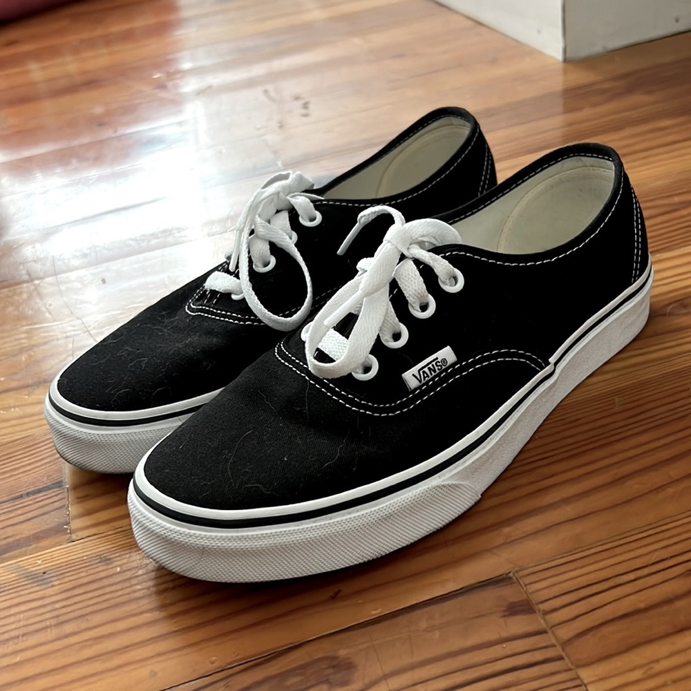 Black and white Vans low top sneakers